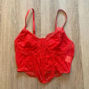 Beautiful lace front solid back soft corset camisole.